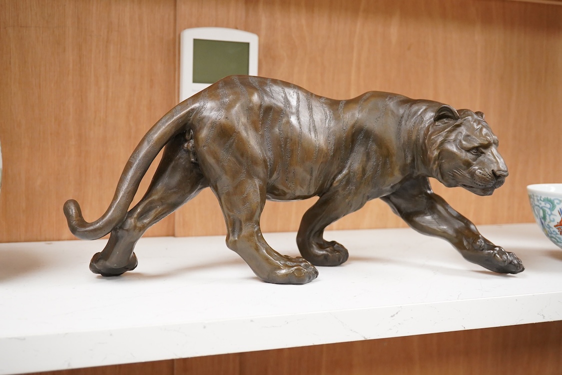 After Salvatore Melani (1902-1934), contemporary patinated bronze of a tiger, 39cm wide